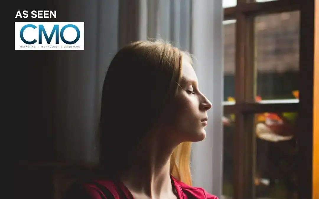 A woman in profile gazes out of a window, with a CMO logo in the corner.