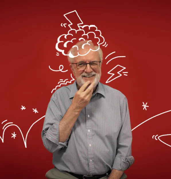 A grey-haired man in a grey shirt strokes his chin against a red background with white hand-drawn doodles.