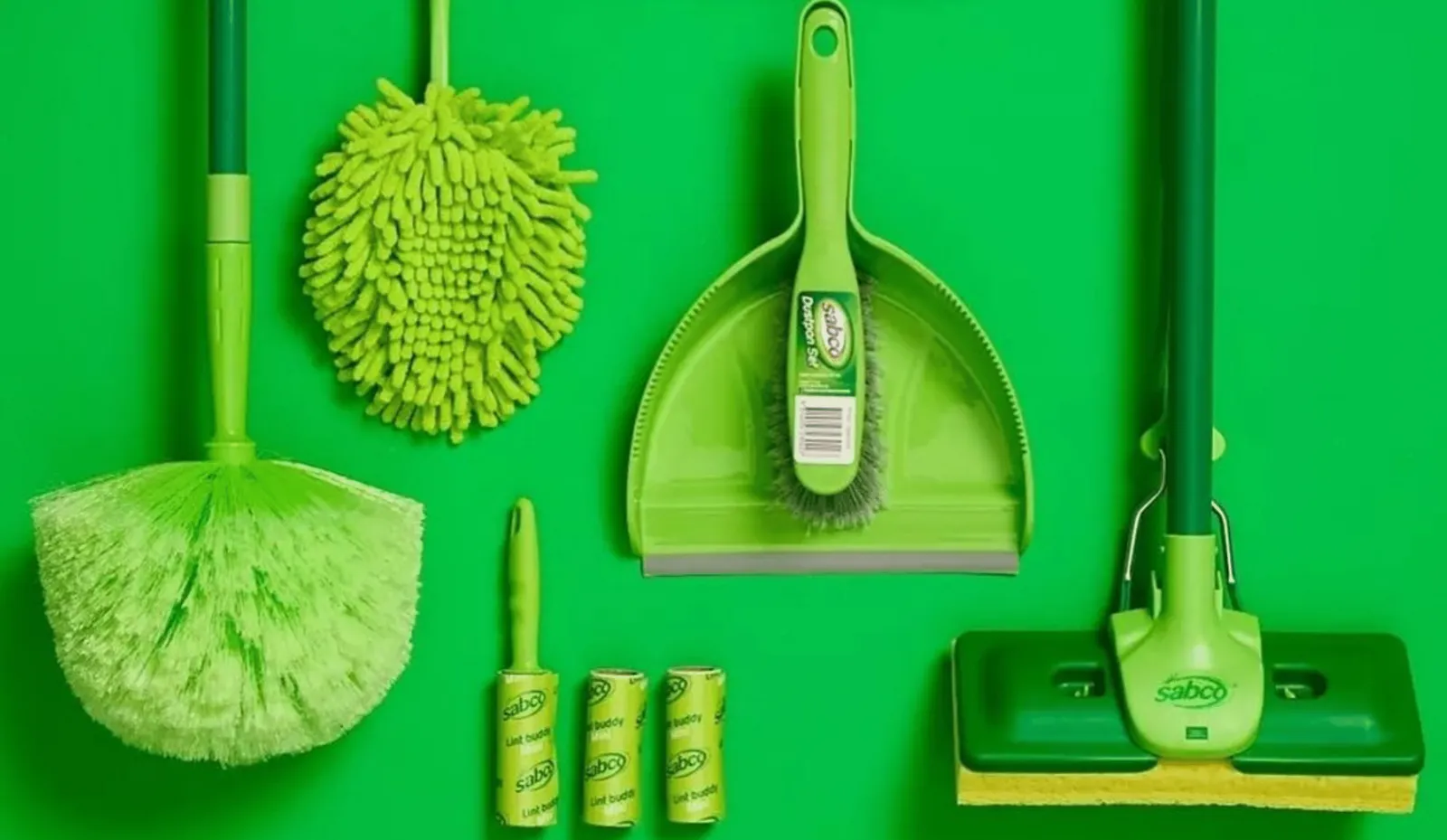 Green Sabco cleaning tools, including a duster, dustpan, mop and lint rollers, on a bright green background.